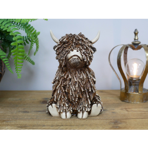 Medium Sitting Highland Cow