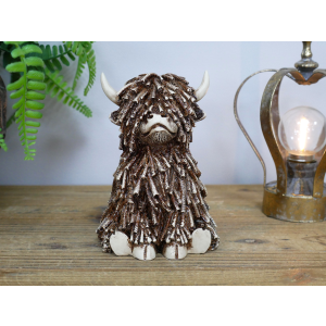 Small Sitting Highland Cow